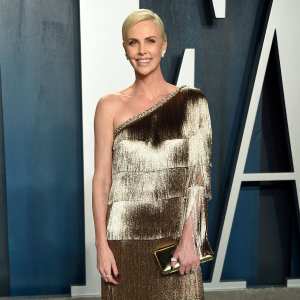 Charlize Theron Posts Rare Pic of Daughter Jackson on Mad Max Oscar Gold Dress