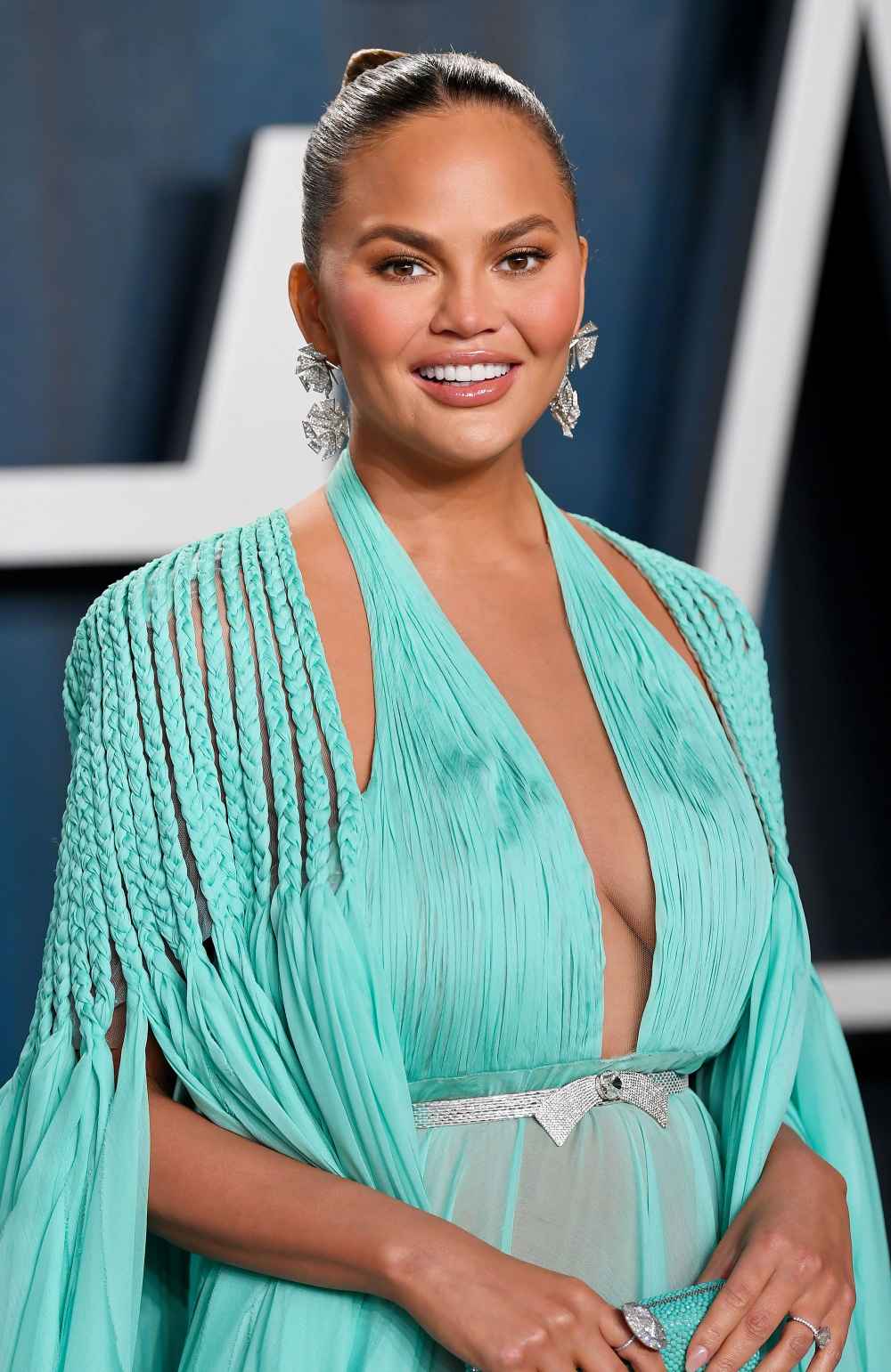 Chrissy Teigen Once Bought a Celine Bag Just to Use the Barneys Bathroom