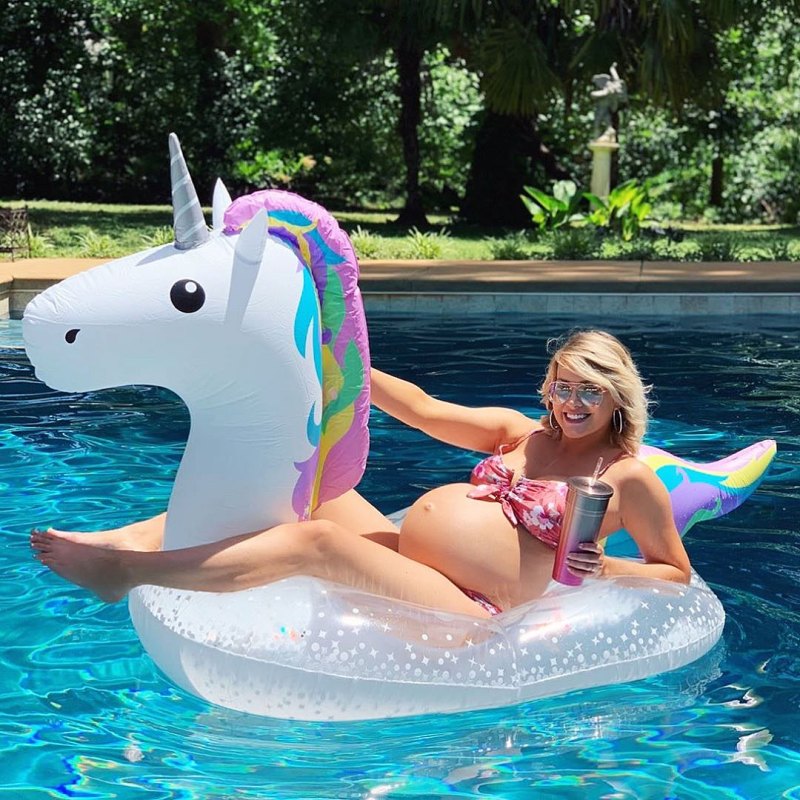 Jenna Cooper Bikini Baby Bump Riding a Unicorn Float