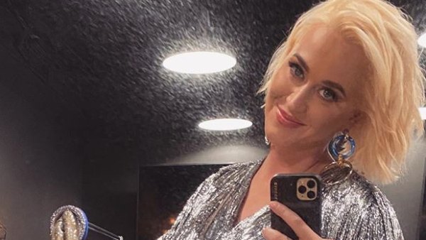 Pregnant Katy Perry Cradles Growing Baby Bump in Silver Dress