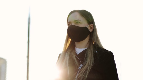 black fabric face mask stock photo