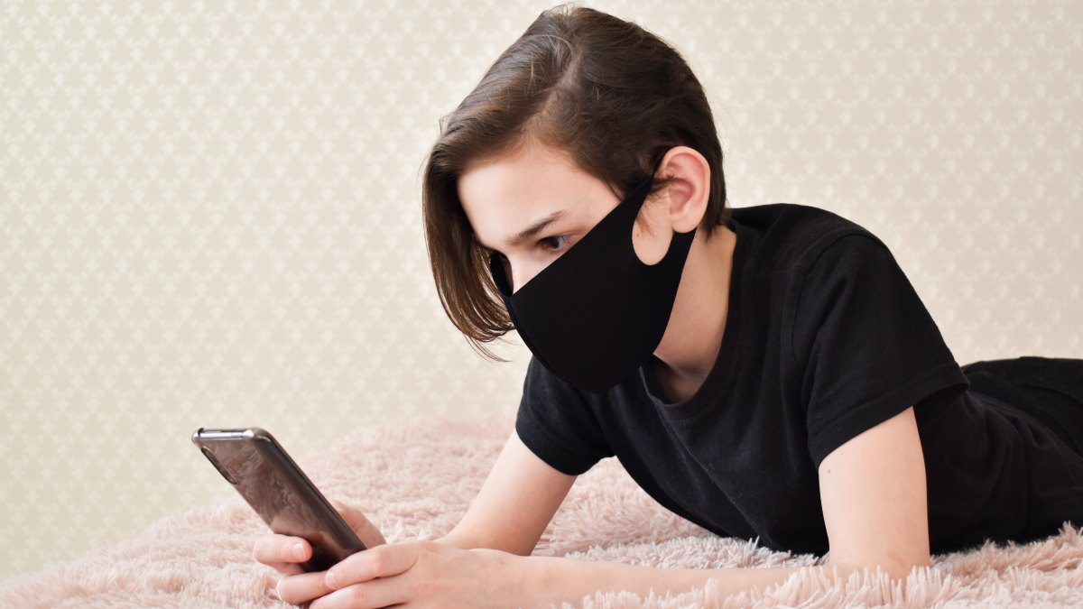 black face mask stock photo