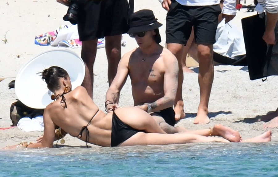 Bella Hadid Stuns in Tiny Black Bikini Shooting on a Beach in Corsica