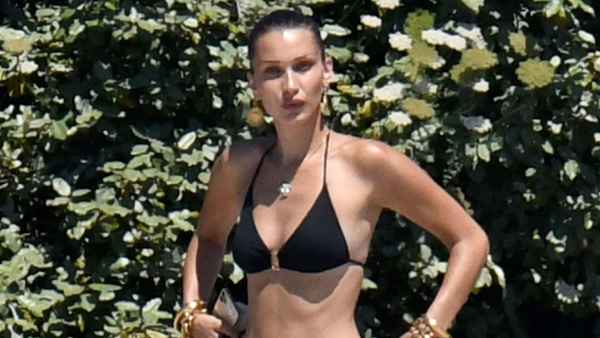 Bella Hadid Stuns in Tiny Black Bikini Shooting on a Beach in Corsica
