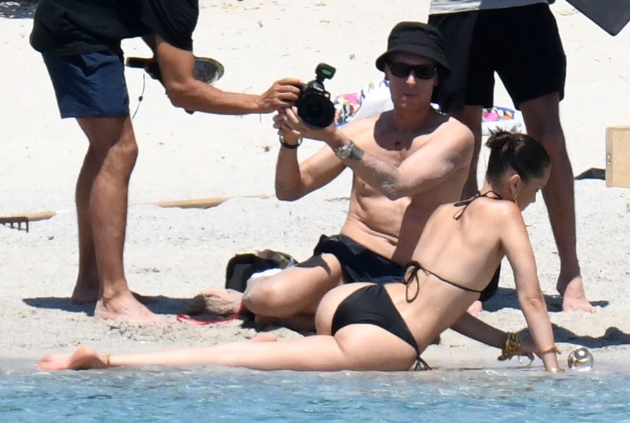 Bella Hadid Stuns in Tiny Black Bikini Shooting on a Beach in Corsica