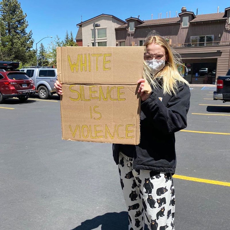 Sophie Turner supporting Black Lives Matter with a Sign that Says White Silence is Violence