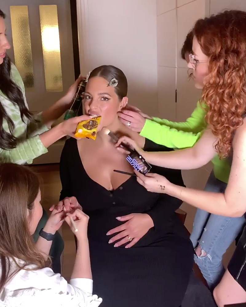 Ashley Graham eating while getting ready
