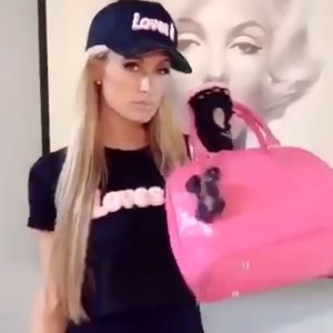 Watch Paris Hilton Work Out With Louis Vuitton Bags