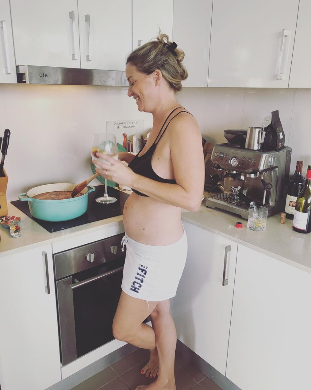 Pregnant Hannah Ferrier Debuts Bare Baby Bump While Cooking
