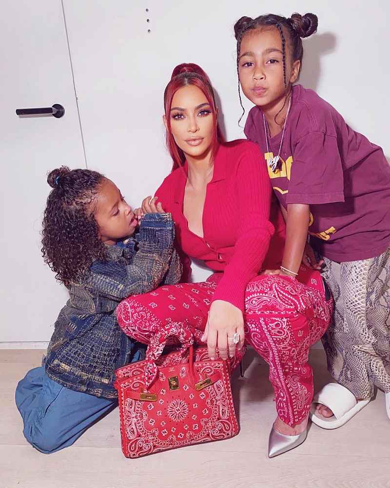 Saint West Kim Kardashian Wearing Red and with Red Hair and North West