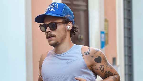Harry Styles Sports 70s-Inspired Quarantine Mustache While Jogging In Rome