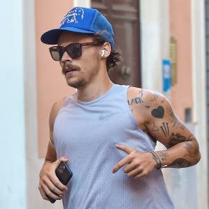 Harry Styles Sports 70s-Inspired Quarantine Mustache While Jogging In Rome
