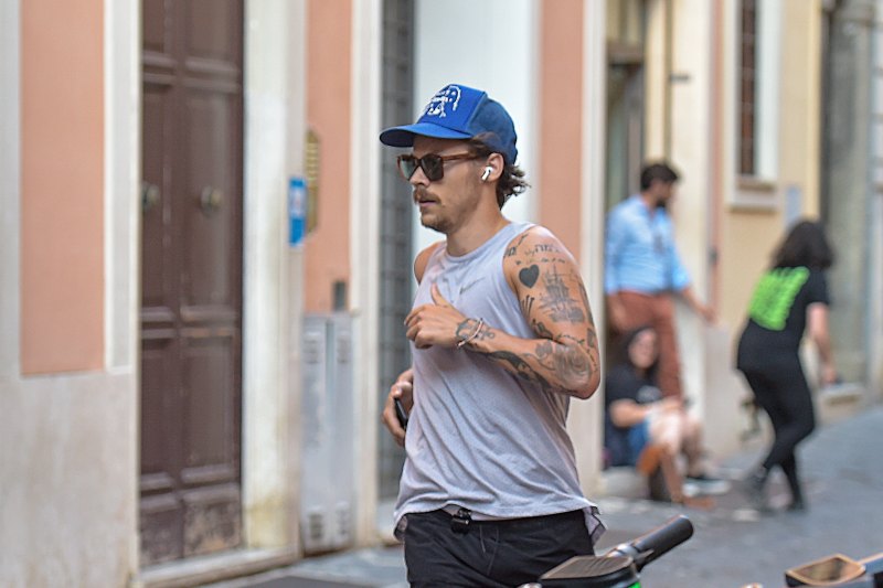 Harry Styles Sports 70s-Inspired Quarantine Mustache While Jogging In Rome