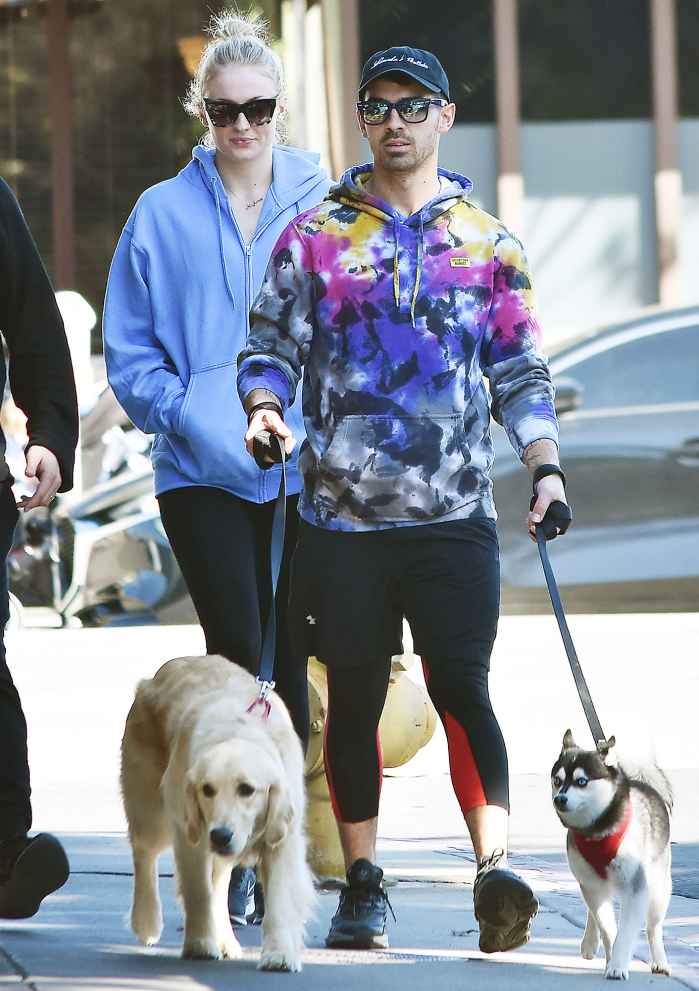 Sophie Turner and Joe Jonas walking their dogs Joe Jonas Pays Tribute to His Squad on National Dog Day