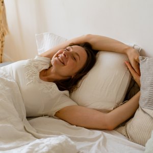 woman in bed waking up
