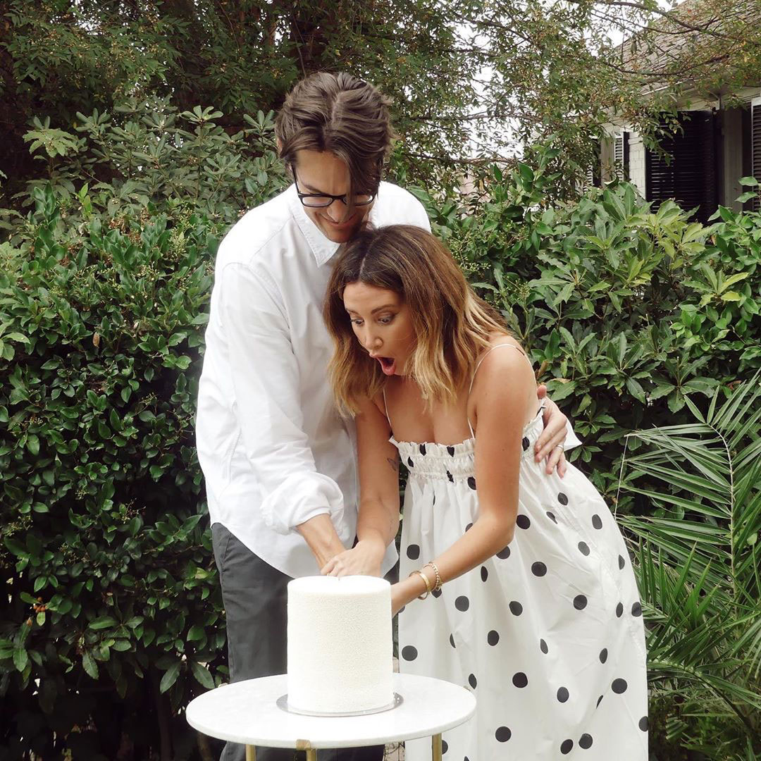 Ashley Tisdale and Christopher French Cake Cutting Sex Reveal Pink White Dress Black Polka Dots