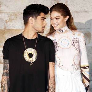 Zayn Malik and Gigi Hadid Looking At Each Other At Paris Fashion Week in 2006 Gigi Hadid and Zayn Malik Have First Date Night as Parents