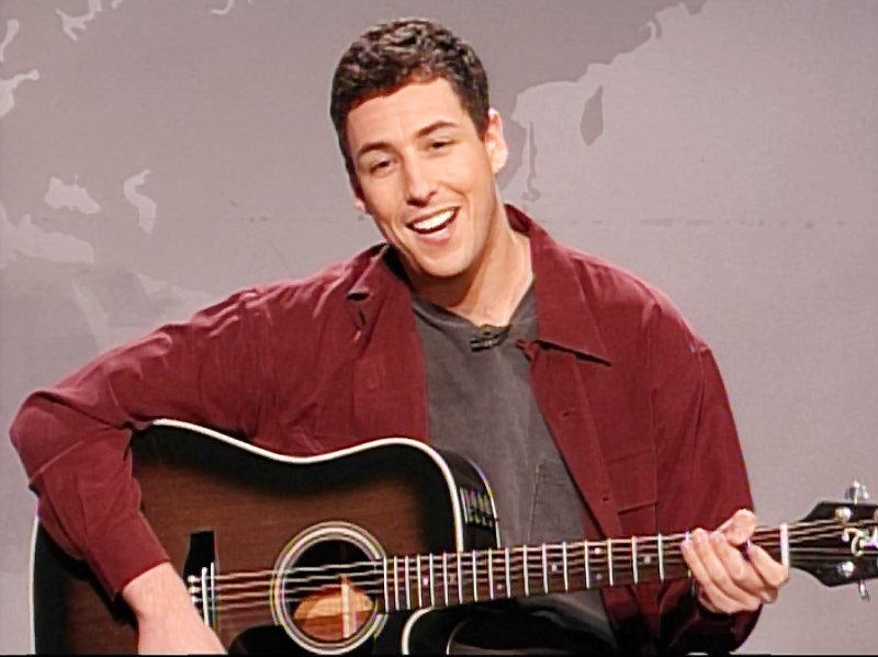 Adam Sandler Playing The Hanukkah Song on Saturday Night Live Best Hanukkah TV Episodes to Watch This Holiday