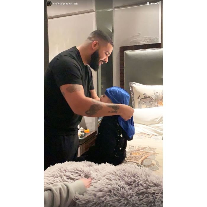 Drake Helps His Son Adonis Get Dressed