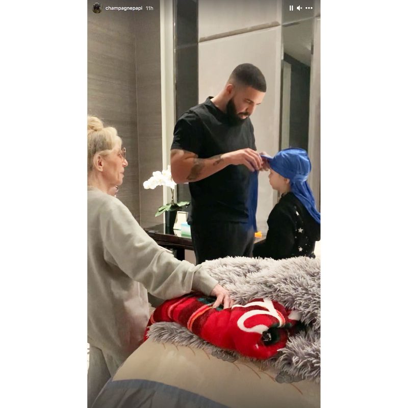 Drake Helps His Son Adonis Get Dressed