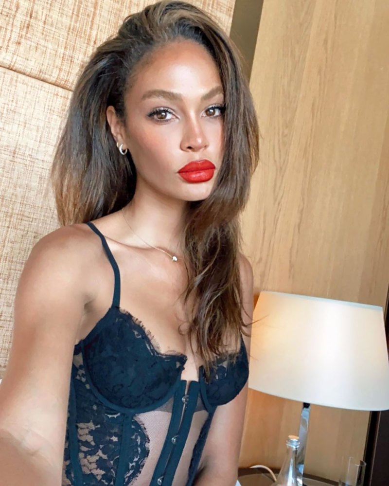 Joan Smalls Is the Ultimate Smoke Show in Lacy Corset and Red Lip