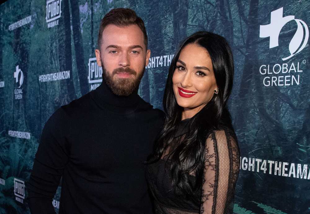 Nikki Bella and Artem Chigvintsev Celebrate 1st Christmas With Son Matteo in Holiday Card