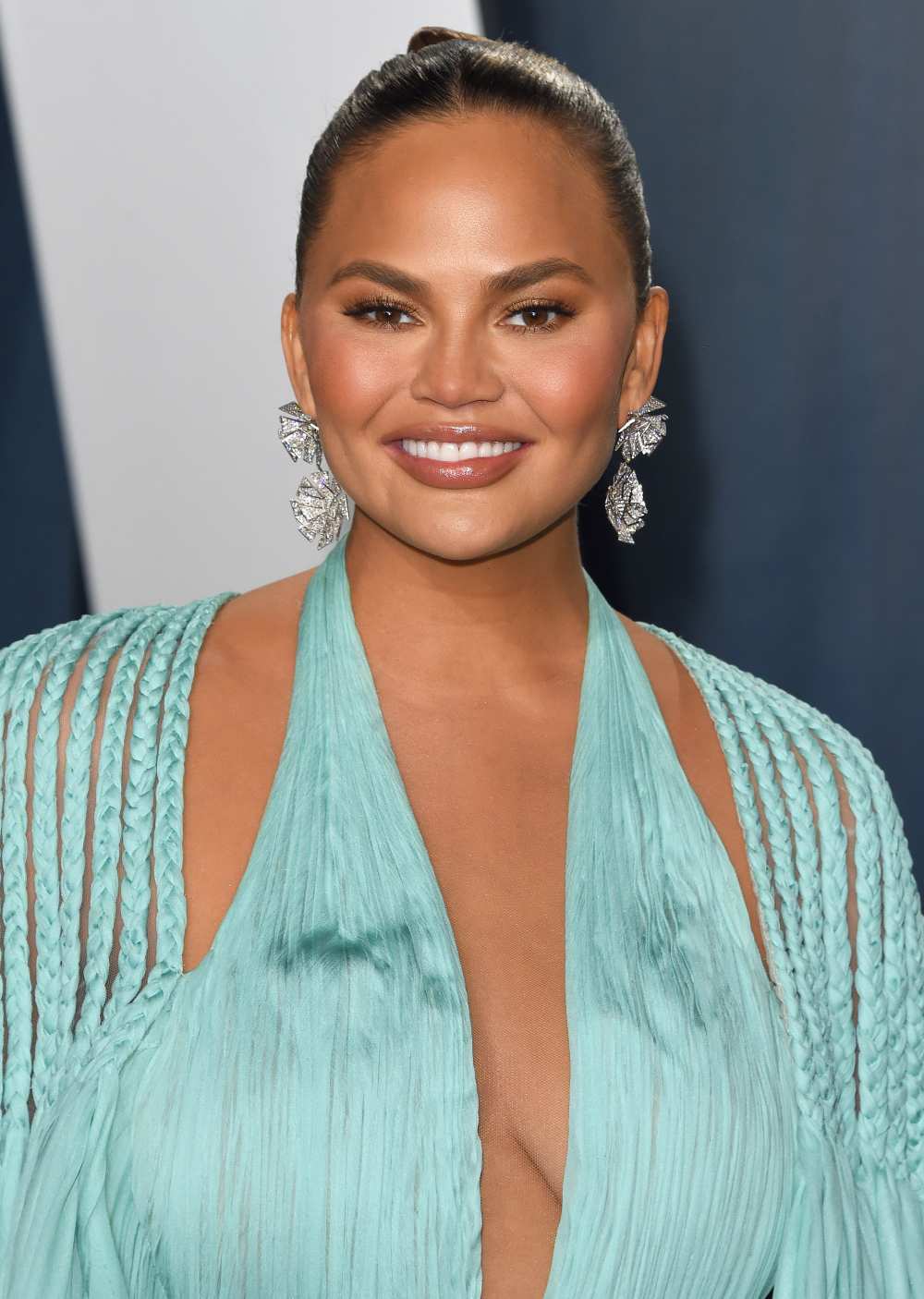 You&rsquo;ll Never Guess the Meaning Behind Chrissy Teigen's Sexy Spine Tattoo