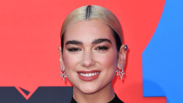 Dua Lipa Denies Pregnancy Rumors After Captioning Pics With Baby Bottle Emoji