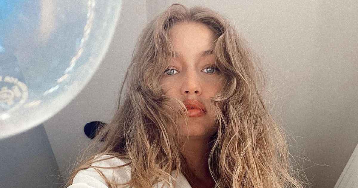 Gigi Hadid Reveals Sculpted, New Mom Abs In An Orange Crop Top