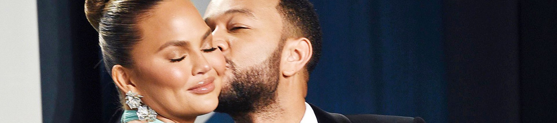 John Legend Kissing Chrissy Teigen on the Cheek