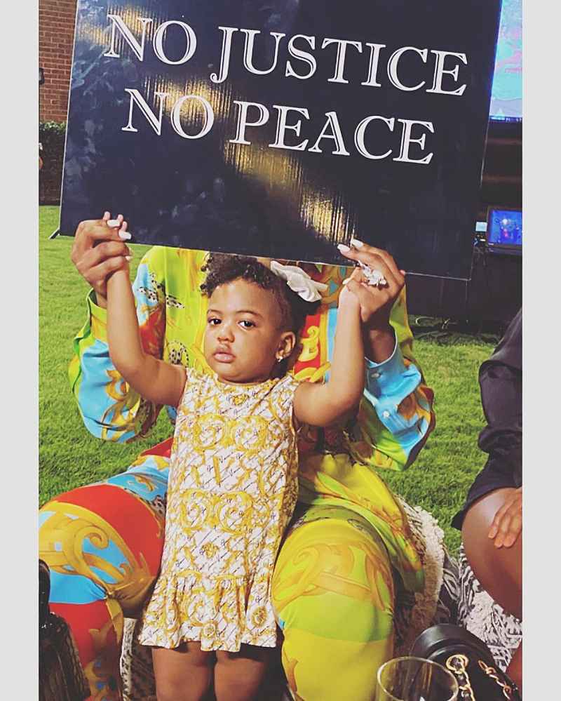 Porsha Williams Daughter Pilar Holding Up A Sign That Says No Justice No Peace