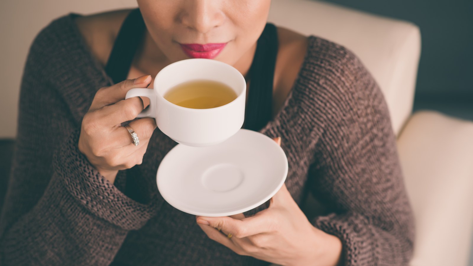 Woman-Sipping-Tea-Stock-Photo
