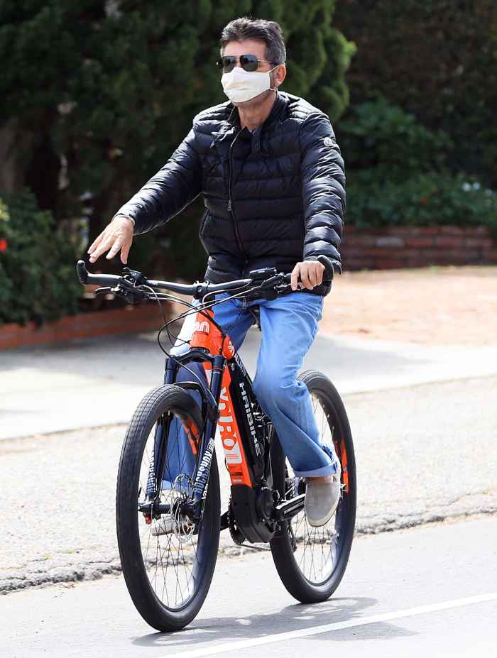Simon Cowell Riding a Bike in April 2020 Simon Cowell Details Experience Injuring His Back in Bike Accident