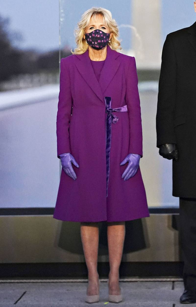 Jill Biden in purple at the Lincoln Memorial Reflecting Pool during a COVID-19 memorial Dr. Jill Biden's most stylish moment since becoming FLOTUS