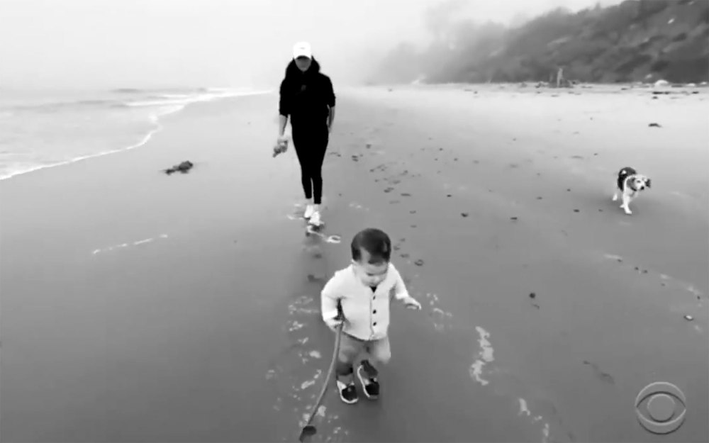 Meghan Markle and Prince Harry's Son Archie Makes Adorable Cameo in Tell-All Interview Archie Running on Beach Holding Stick Black and White