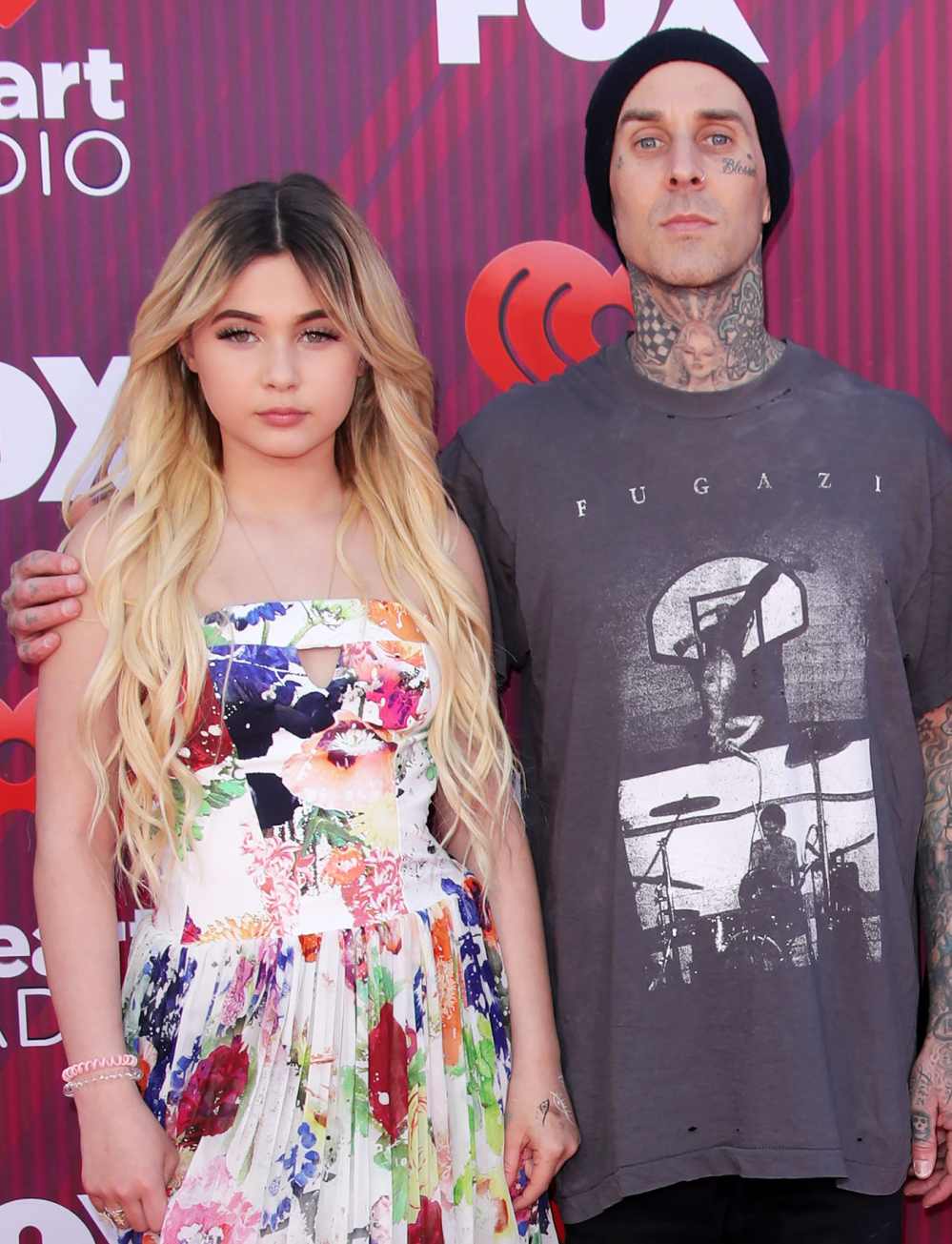 Watch Travis Barker’s Daughter Cover His Face Tattoos With Foundation