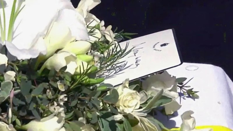 Queen Elizabeth II Left Touching Handwritten Note on Prince Philips Coffin Inline