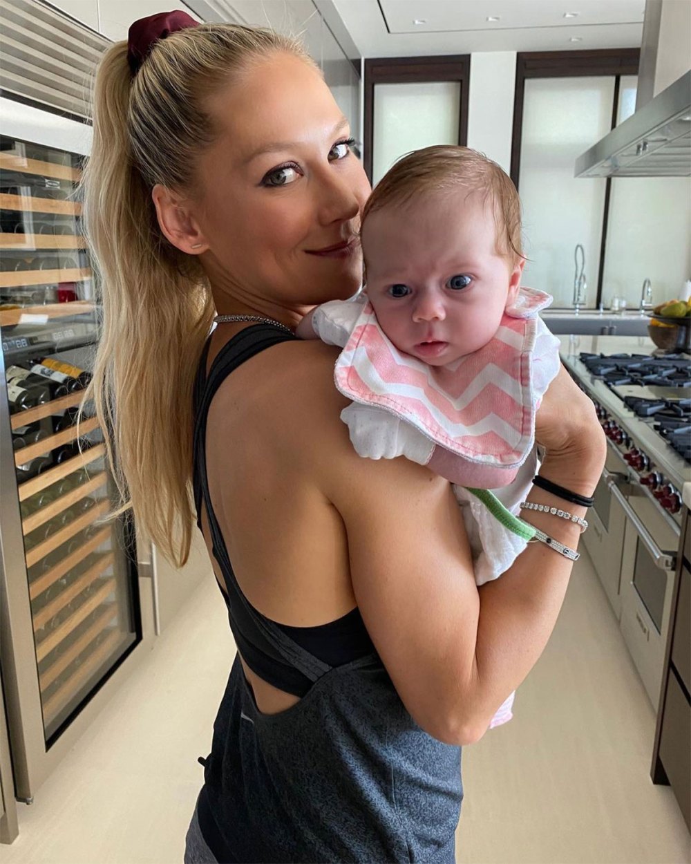 Anna Kournikova Holds Baby