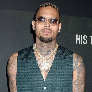 Chris Brown 24-Carat Gold Grill Magnetically Attaches to His Teeth
