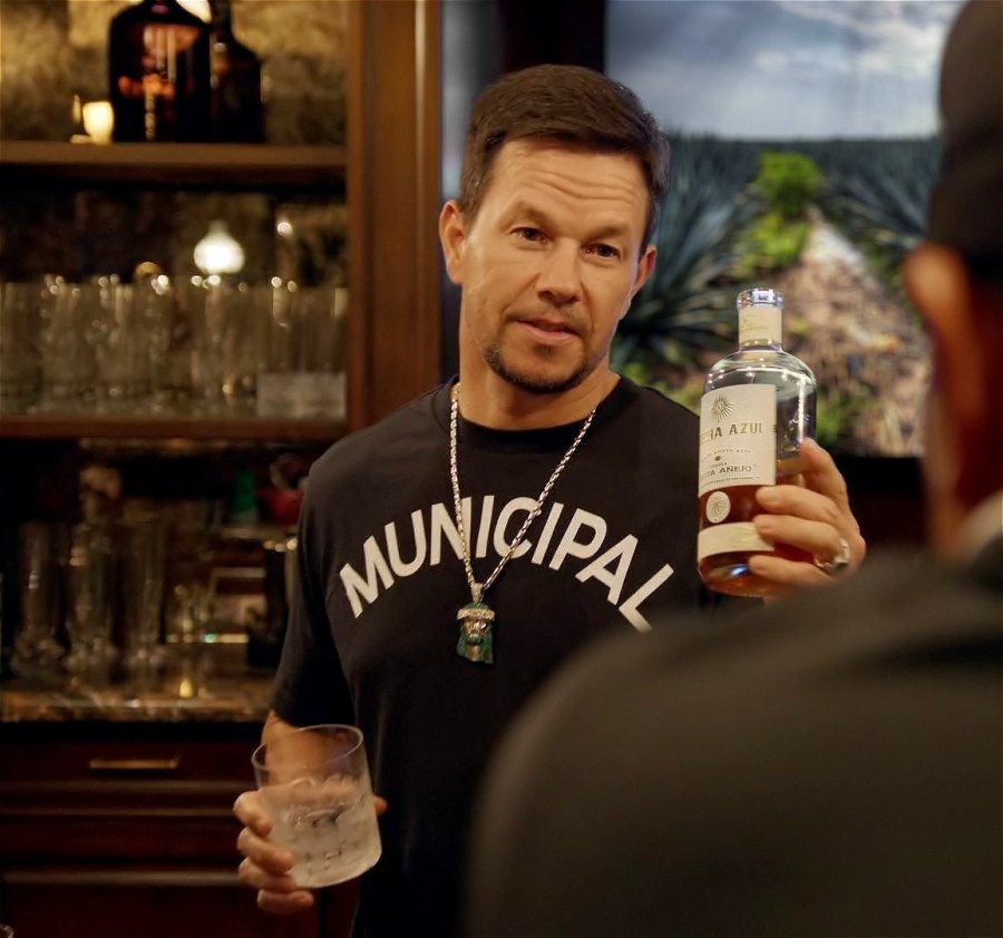 Mark Wahlberg holds his Flecha Azul tequila
