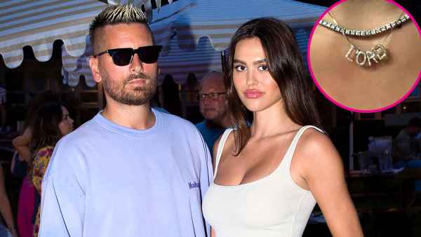 Amelia Hamlin Has a Diamond ‘Lord’ Necklace in Honor of Scott Disick blue shirt, white top, green pants, gold watch
