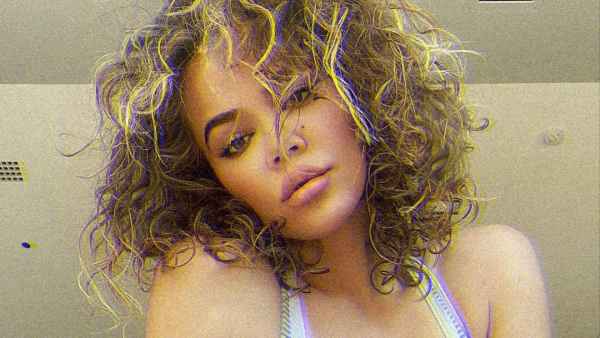 Khloe Kardashian Just Showed Off Her Natural Curls and Fans Are Going Absolutely Wild
