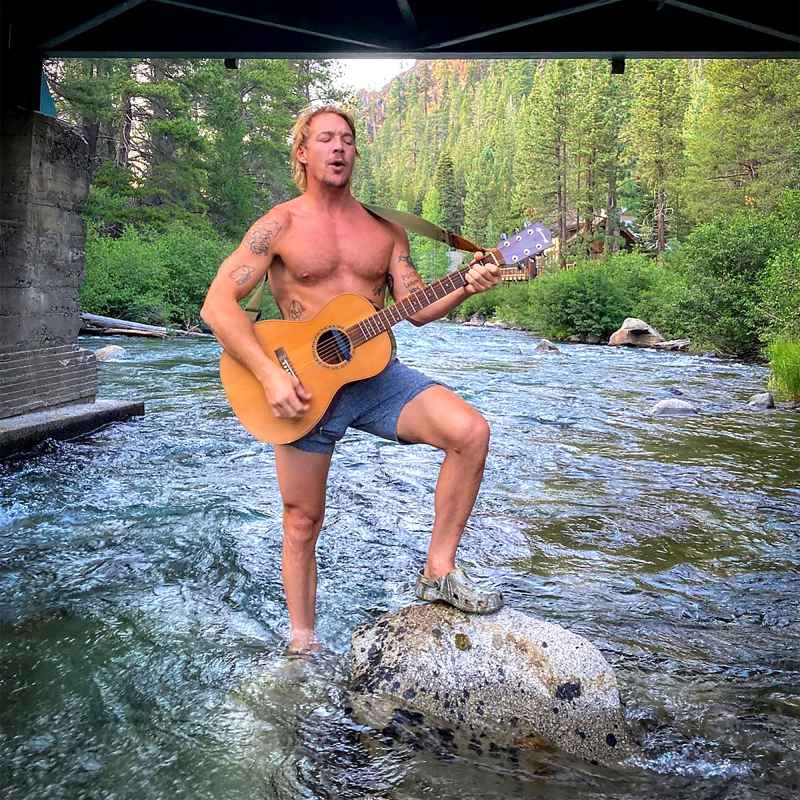 LOL! Take a Moment to Look at Shirtless Diplo Playing Guitar in a Creek