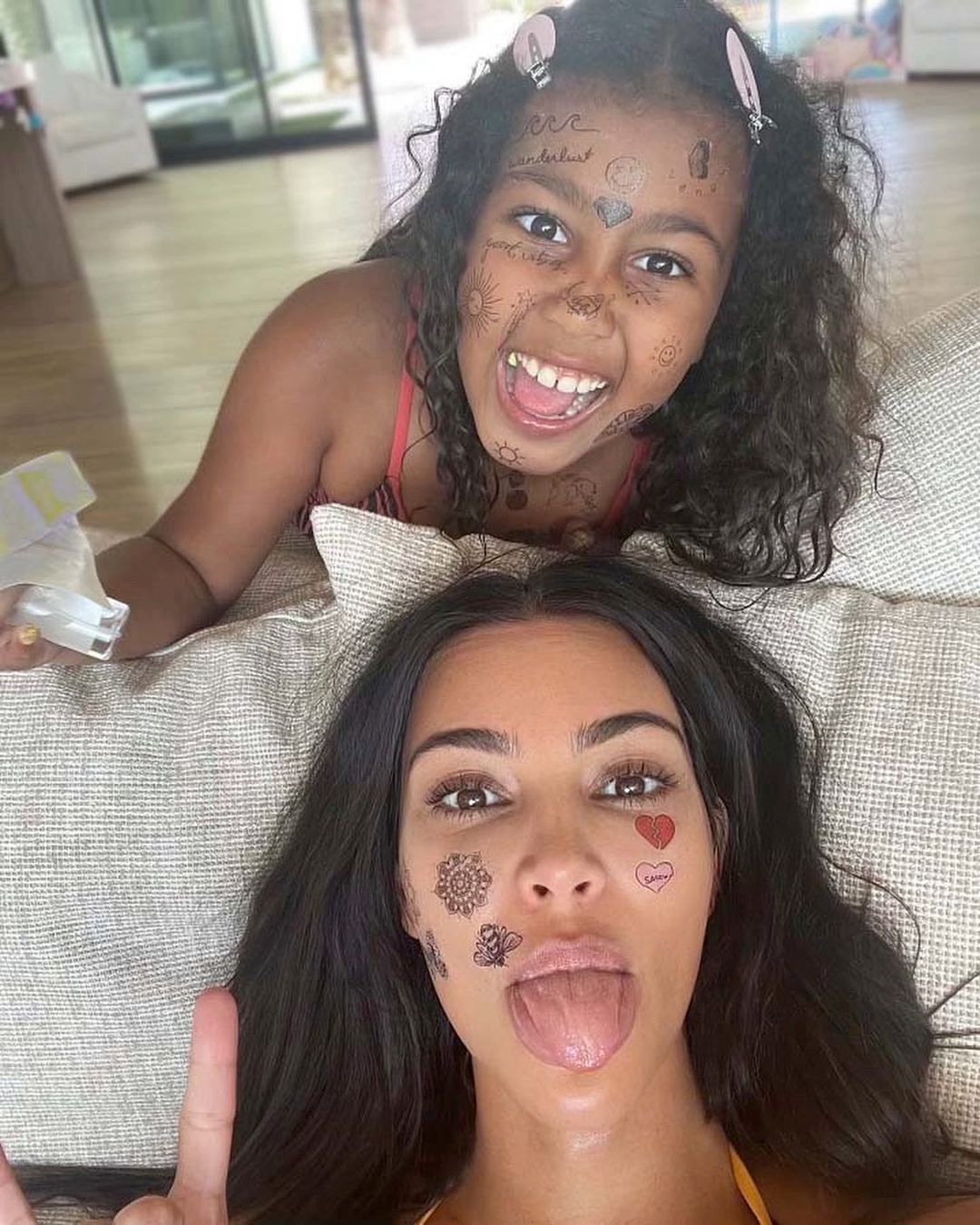 Kim Kardashian and Daughter North, 8, Rock Fake Face Tattoos in New Selfie