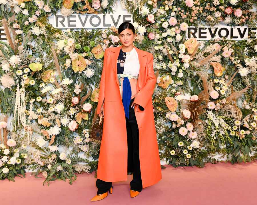 Kylie Jenner shows baby bump at red carpet at REVOLVE Gallery.