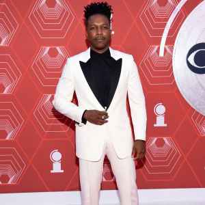 Leslie Odom Jr poses on the red carpet at the Tony Awards
