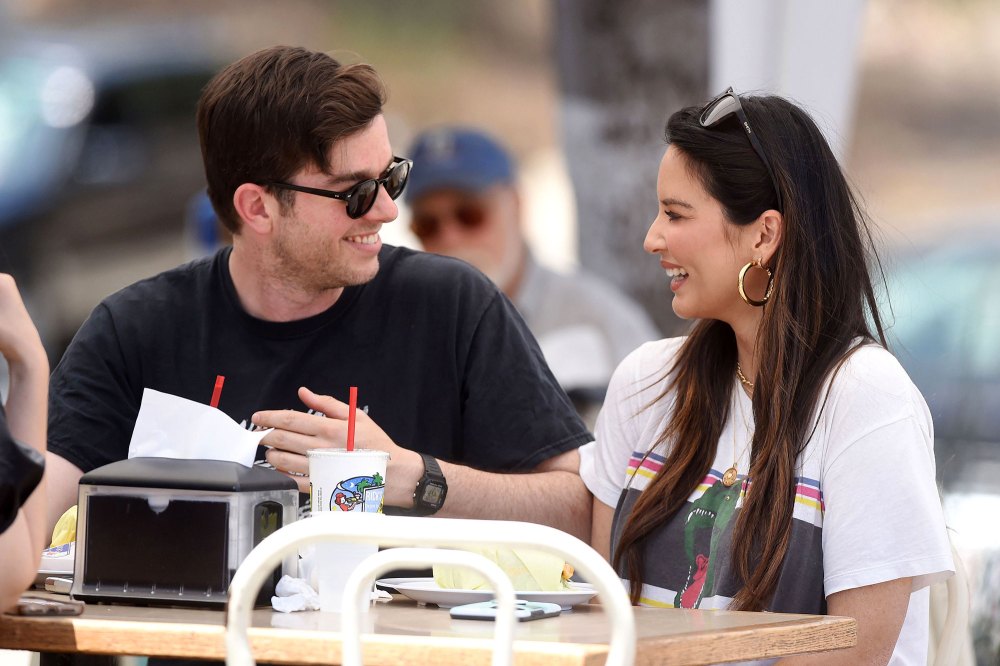Pregnant Olivia Munn Shows Baby Bump Progress in New Photo With John Mulaney Eating Smile Sunglasses Hoop Earring
