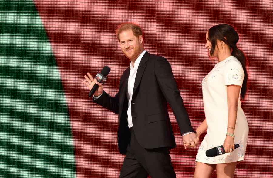 Meghan Markle and Prince Harry hold hands