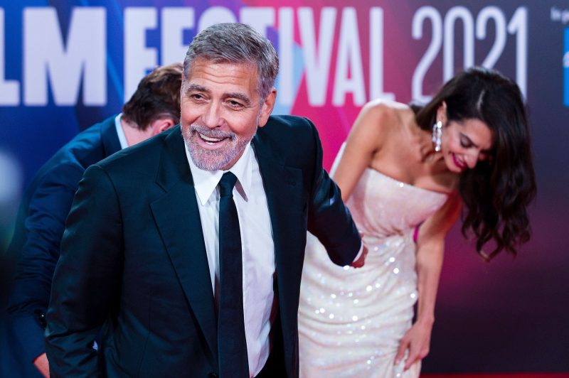 George Clooney Helps Wife Amal Avoid Major Wardrobe Malfunction at Tender Bar Premiere 1