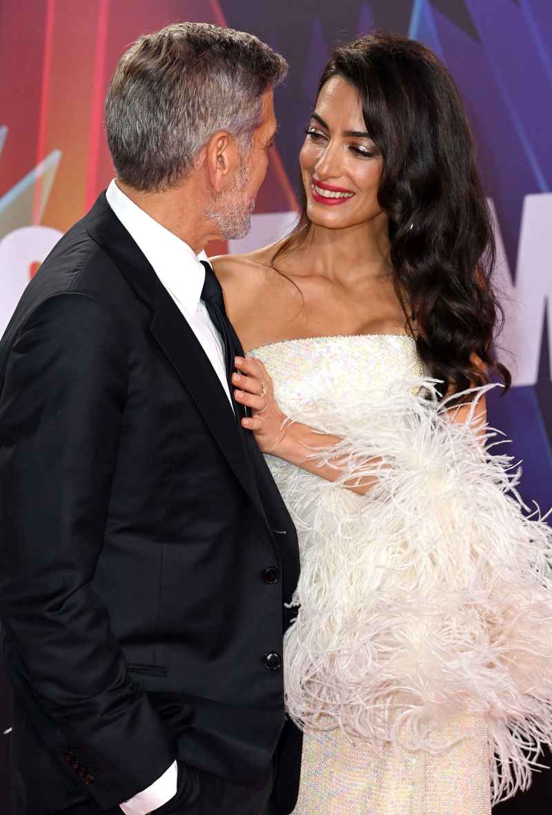 George Clooney Helps Wife Amal Avoid Major Wardrobe Malfunction at Tender Bar Premiere 11
